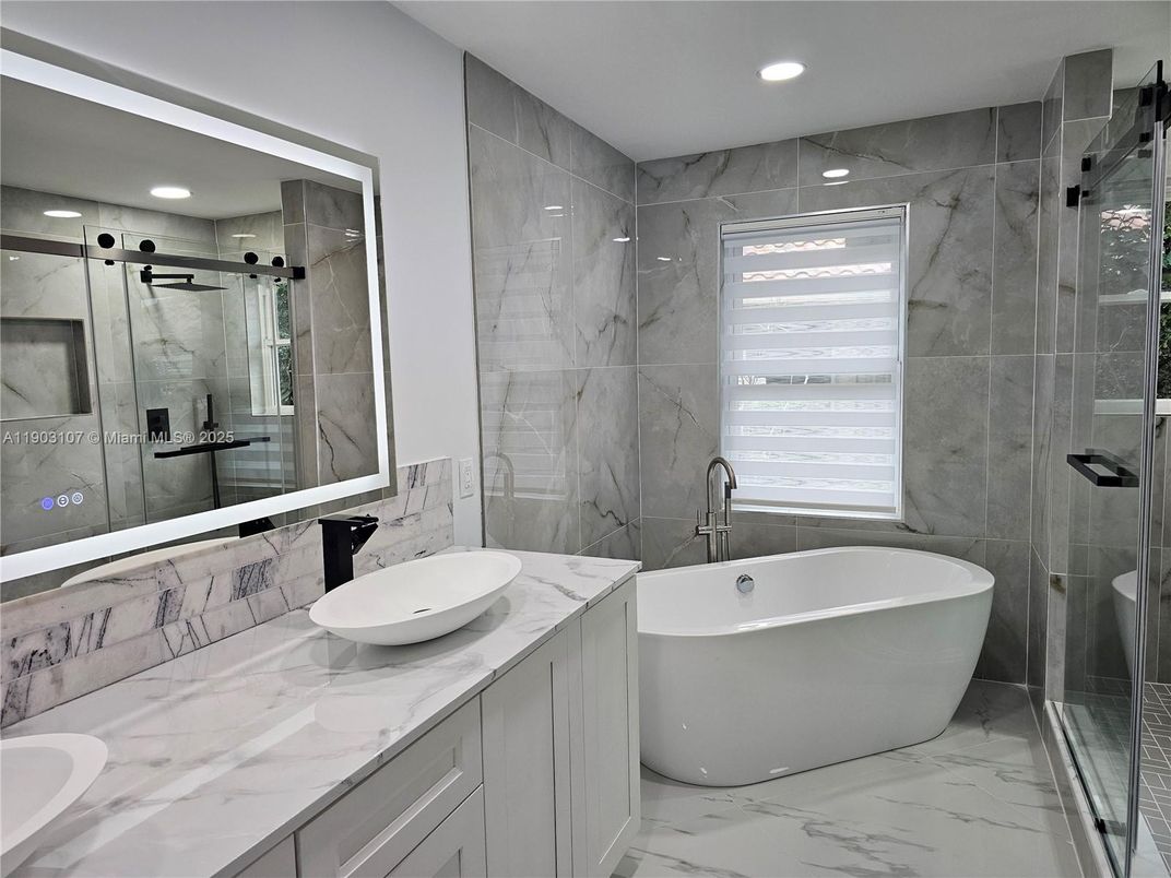 Bathroom, Dual Sink Vanities, Free Standing Baths, Glass Shower, Interior, Marble, Marble Walls, Recessed Lighting