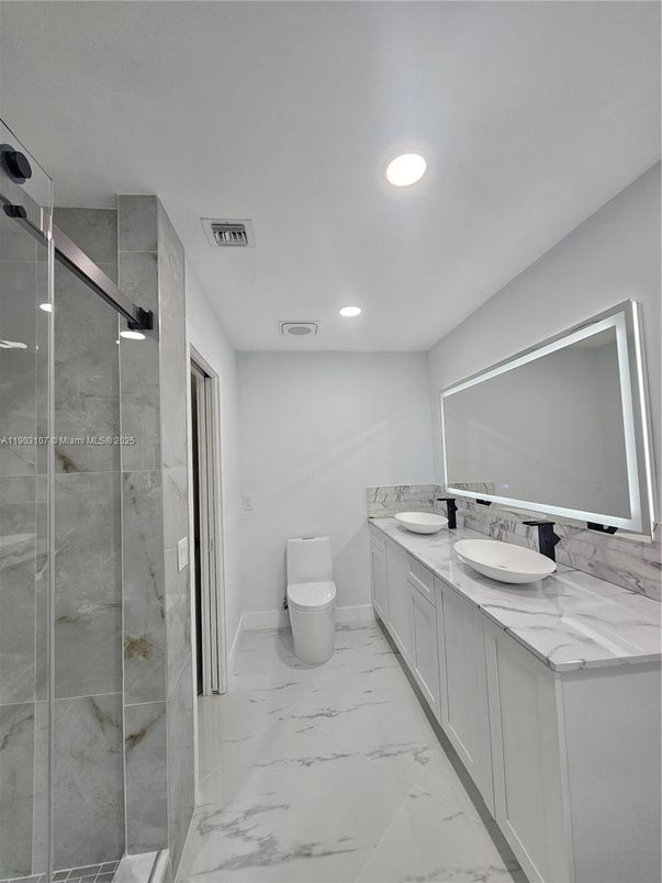 Bathroom, Dual Sink Vanities, Glass Shower, Interior, Marble, Recessed Lighting