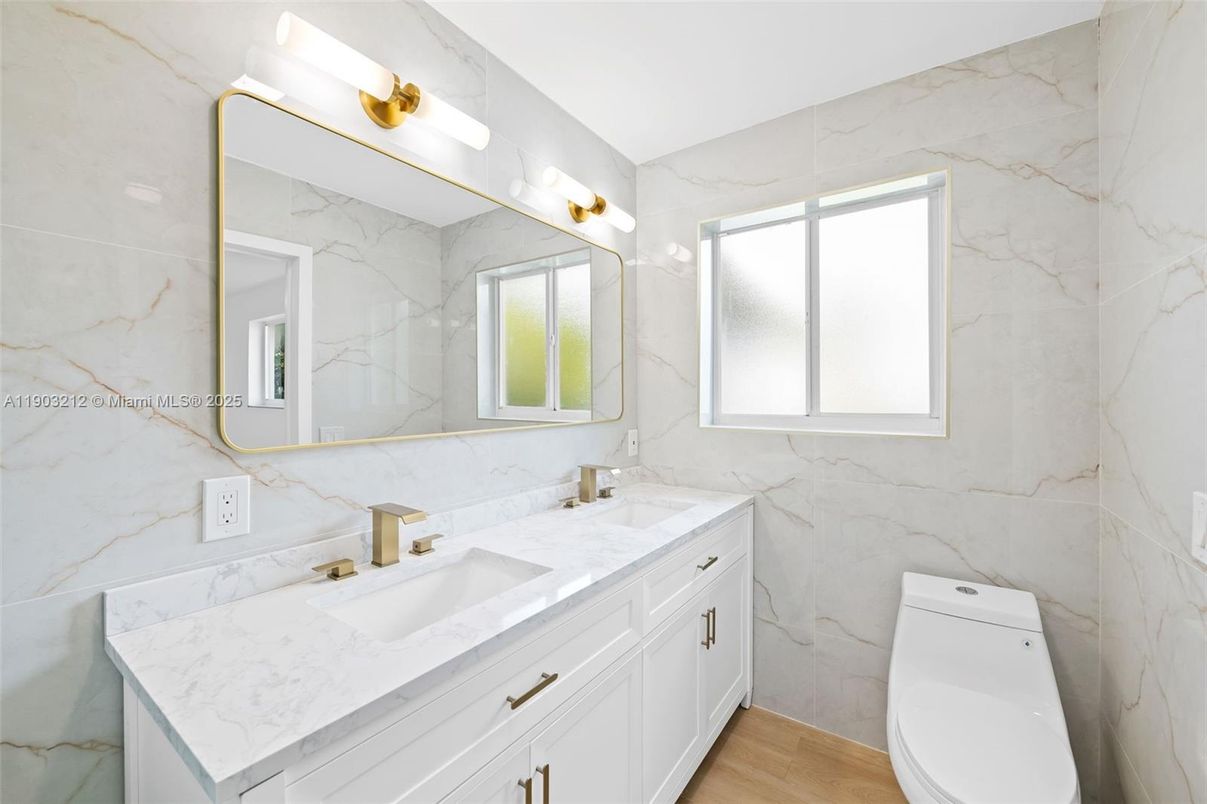 Bathroom, Dual Sink Vanities, Interior, Marble Walls, Wood Texture Flooring