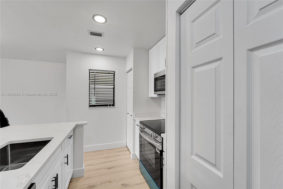 Interior, Kitchen, Recessed Lighting, Stainless Steel Appliances, Wood Texture Flooring