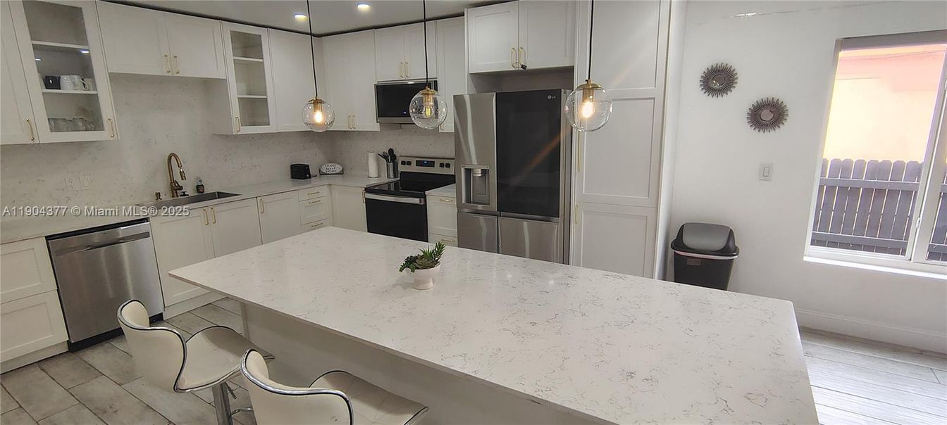 Interior, Kitchen, Pendant Lights, Recessed Lighting, Stainless Steel Appliances, Wood Texture Flooring