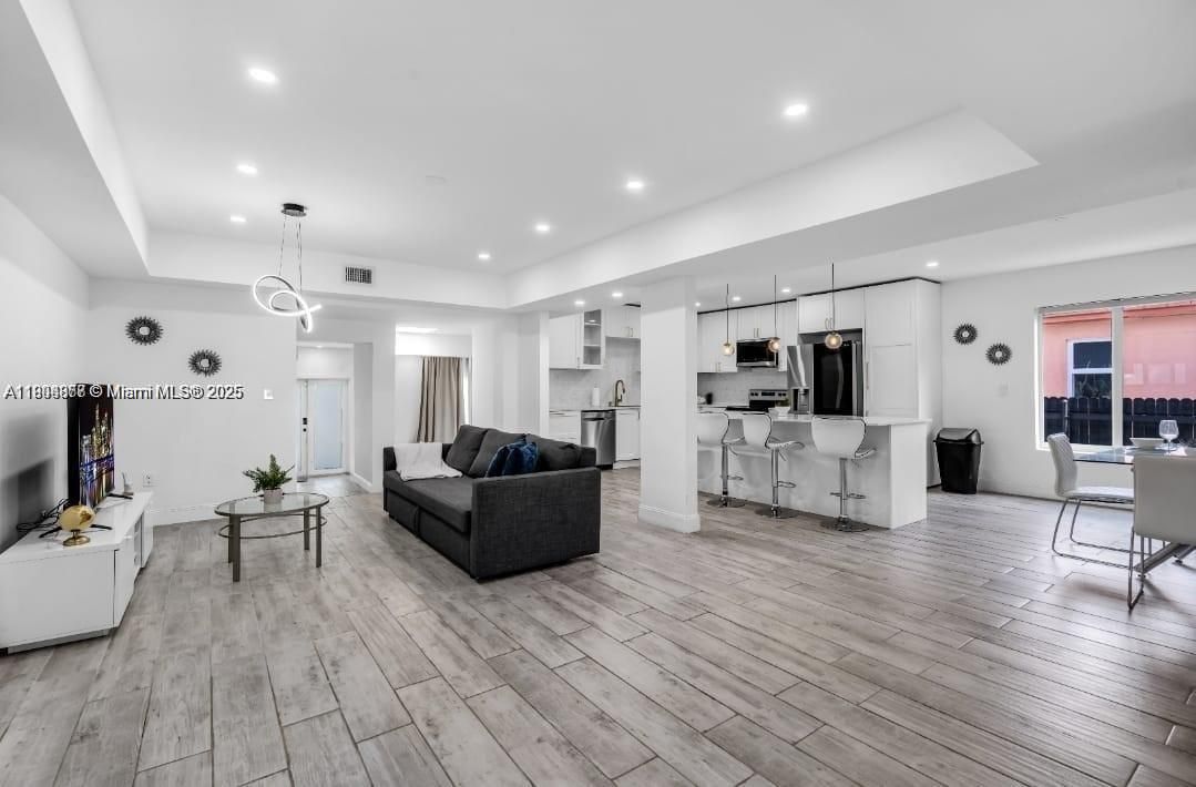 Dining room, Interior, Kitchen, Living room, Pendant Lights, Recessed Lighting, Stainless Steel Appliances, Wood Texture Flooring