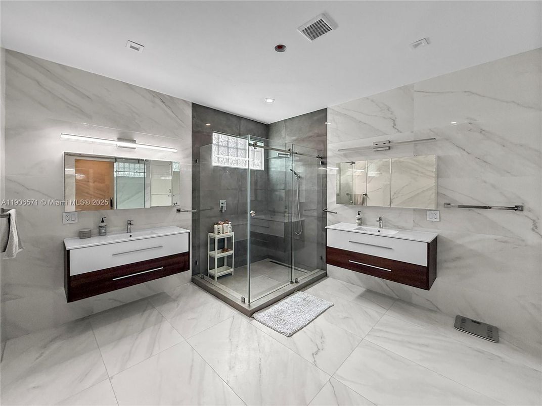 Bathroom, Dual Sink Vanities, Glass Shower, Interior, Marble, Marble Walls, Recessed Lighting