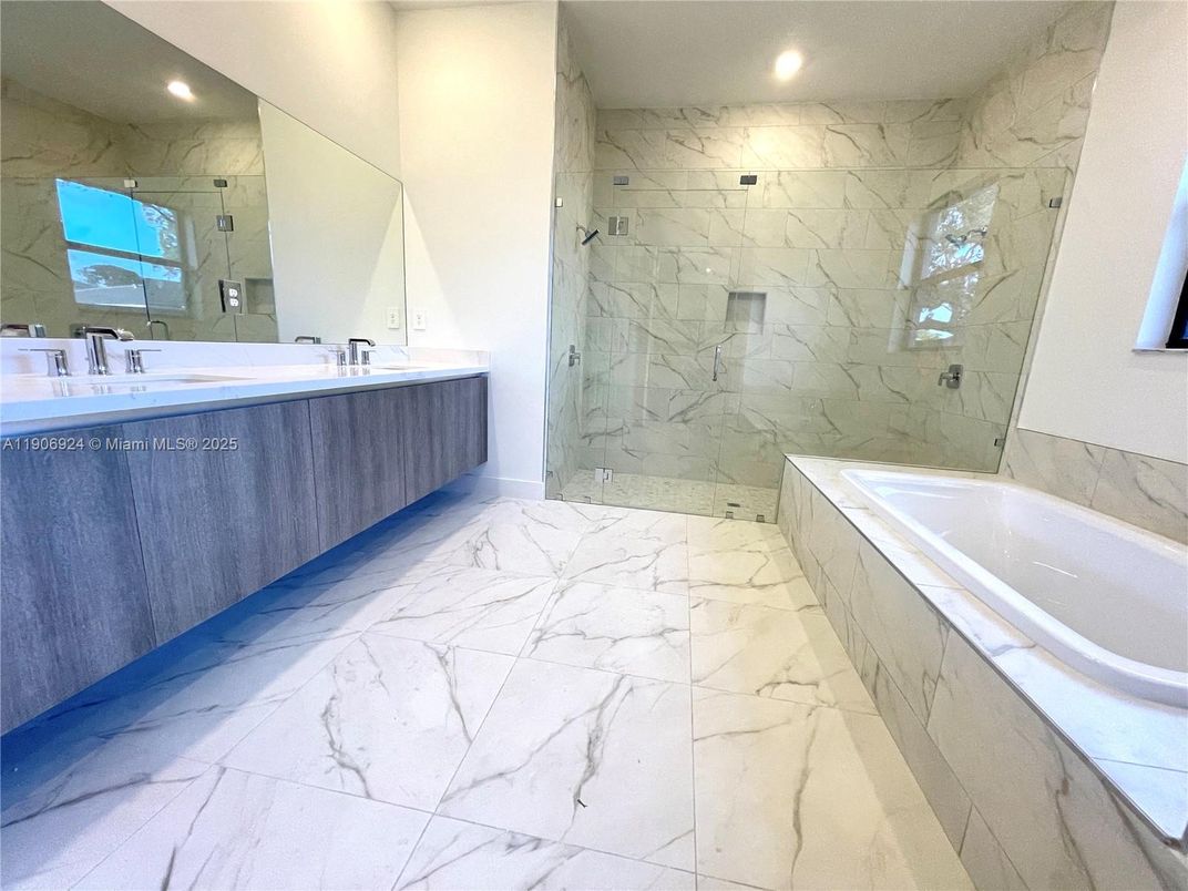 Bathroom, Dual Sink Vanities, Glass Shower, Interior, Marble, Marble Walls, Recessed Lighting