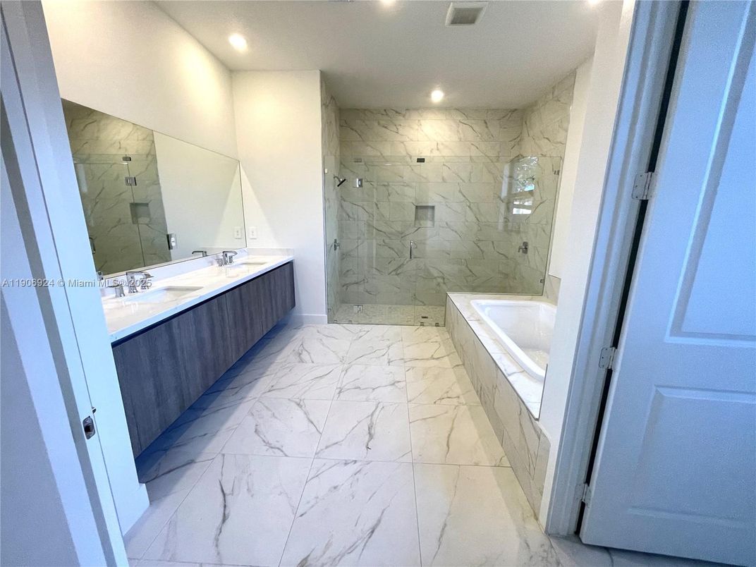 Bathroom, Dual Sink Vanities, Glass Shower, Interior, Marble, Marble Walls, Recessed Lighting
