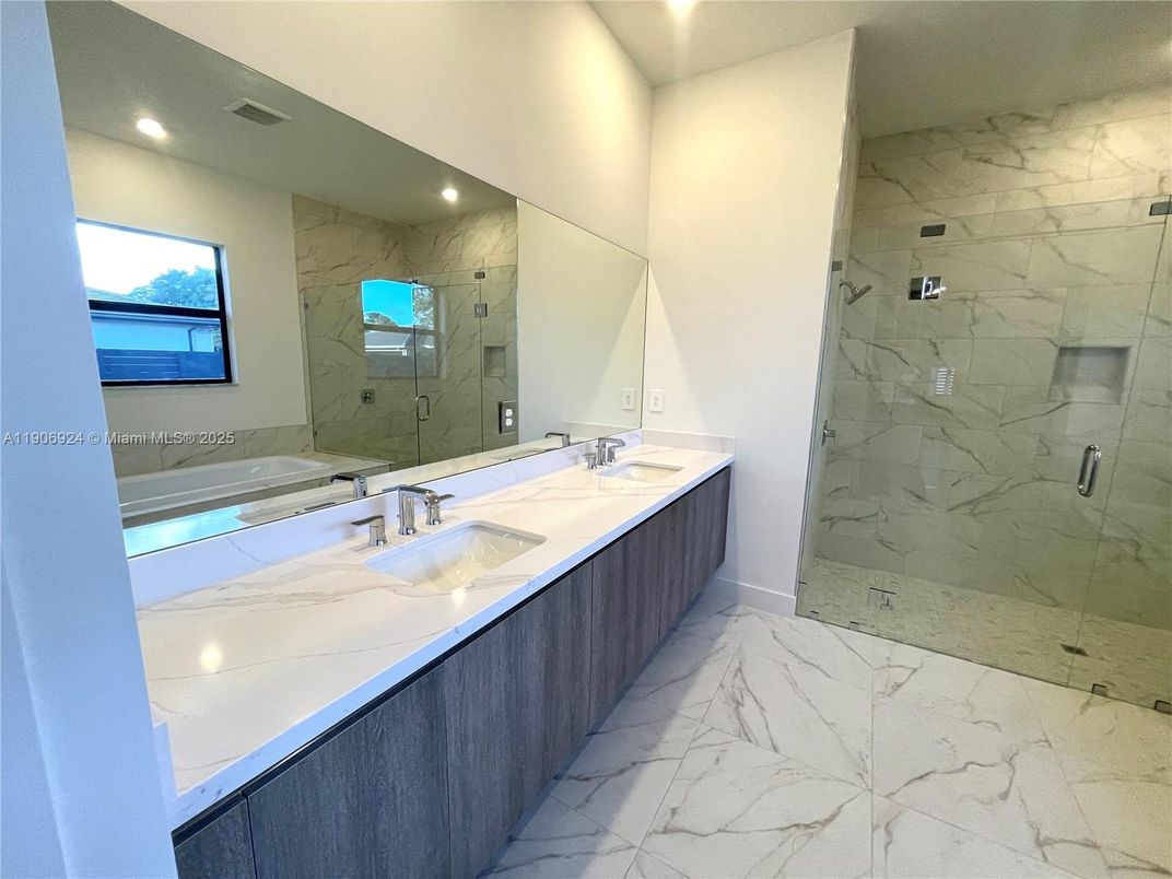 Bathroom, Dual Sink Vanities, Glass Shower, Interior, Marble, Marble Walls, Recessed Lighting