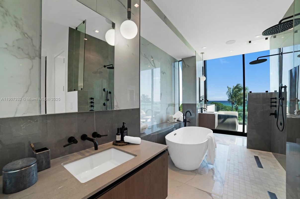 Bathroom, Dual Sink Vanities, Free Standing Baths, Glass Shower, Interior, Marble Walls, Recessed Lighting, Water