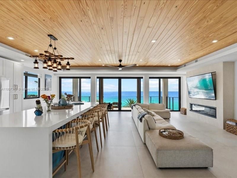 Fireplace, Interior, Living room, Pendant Lights, Recessed Lighting, Water, Wooden Ceilings