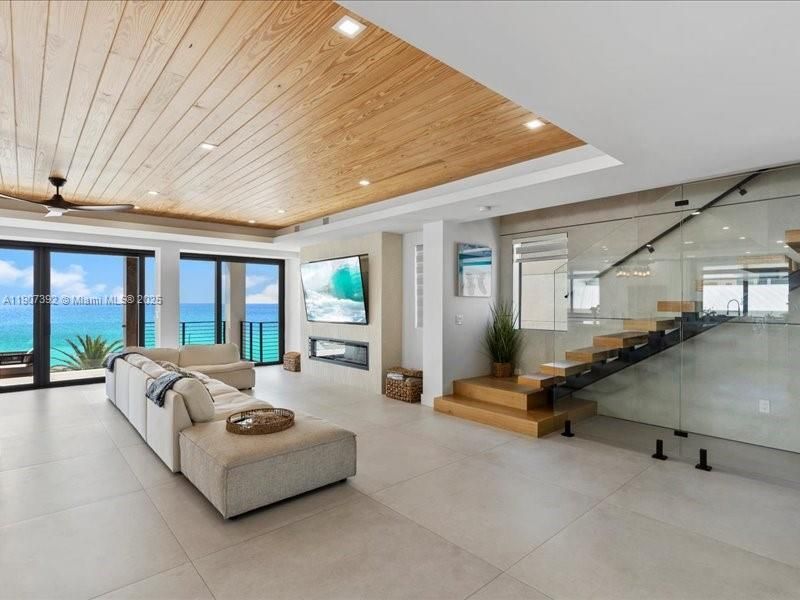 Fireplace, Interior, Living room, Recessed Lighting, Water, Wooden Ceilings