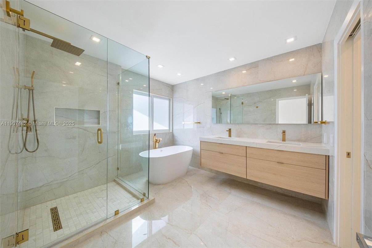 Bathroom, Dual Sink Vanities, Free Standing Baths, Glass Shower, Interior, Marble Walls, Recessed Lighting