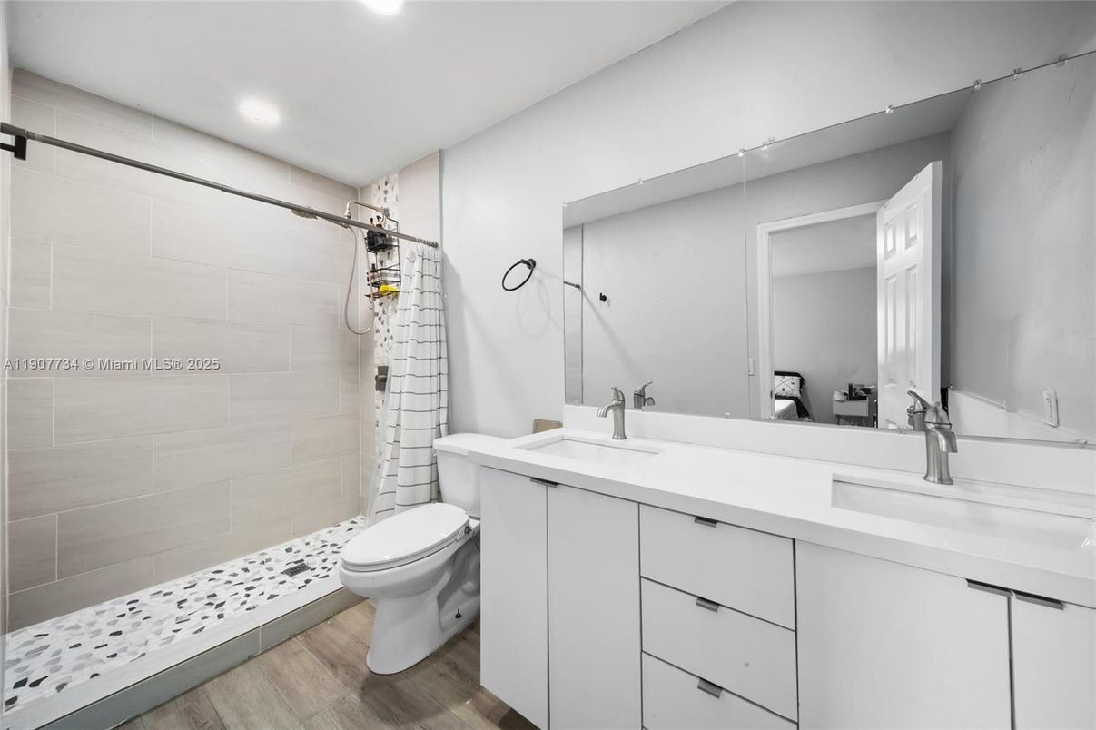 Bathroom, Dual Sink Vanities, Interior, Recessed Lighting, Wood Texture Flooring