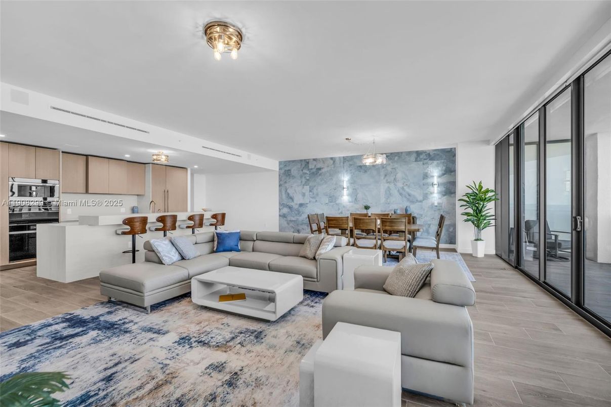 Dining room, Interior, Kitchen, Living room, Marble Walls, Pendant Lights, Recessed Lighting, Stainless Steel Appliances, Wood Texture Flooring