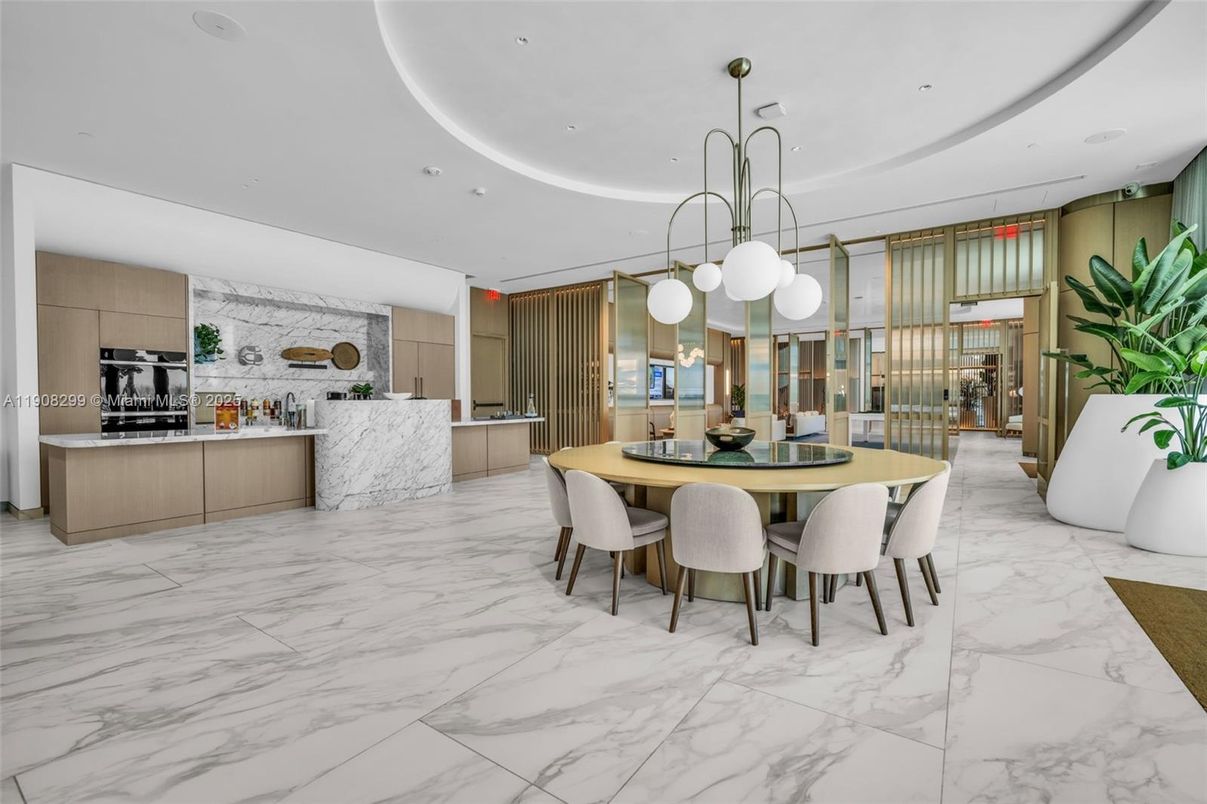 Dining room, Interior, Kitchen, Marble, Marble Walls, Pendant Lights, Recessed Lighting, Stainless Steel Appliances