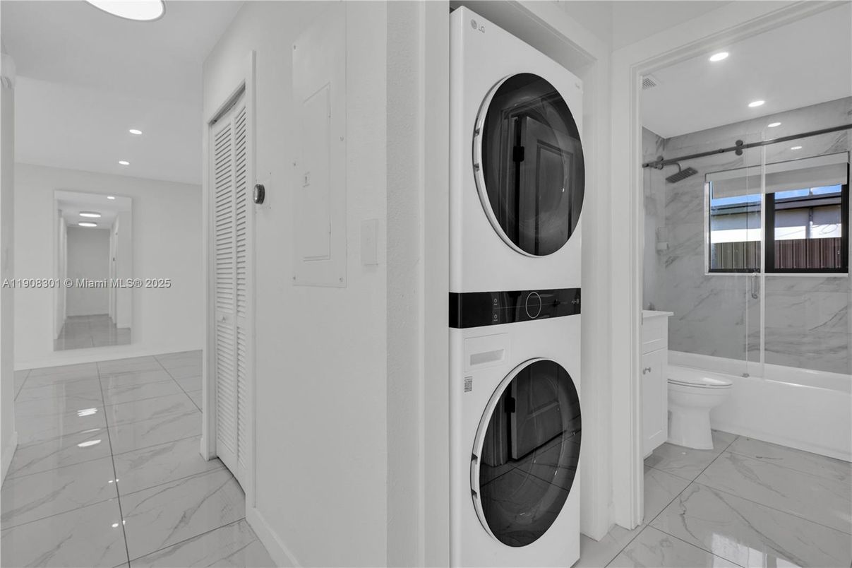 Bathroom, Glass Shower, Interior, Marble, Marble Walls, Recessed Lighting, Utility Closets, Washer