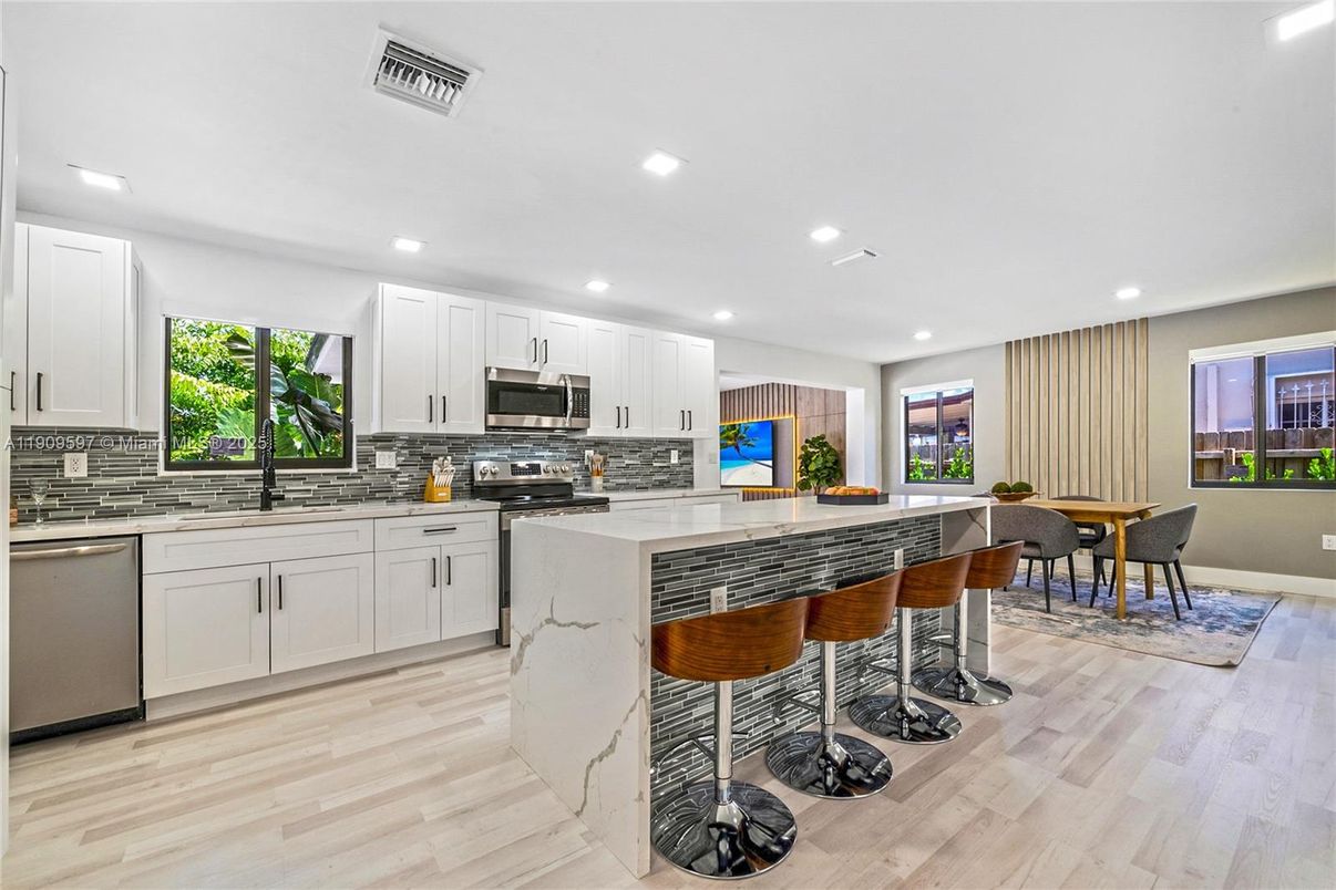 Dining room, Interior, Kitchen, Recessed Lighting, Stainless Steel Appliances, Wood Texture Flooring