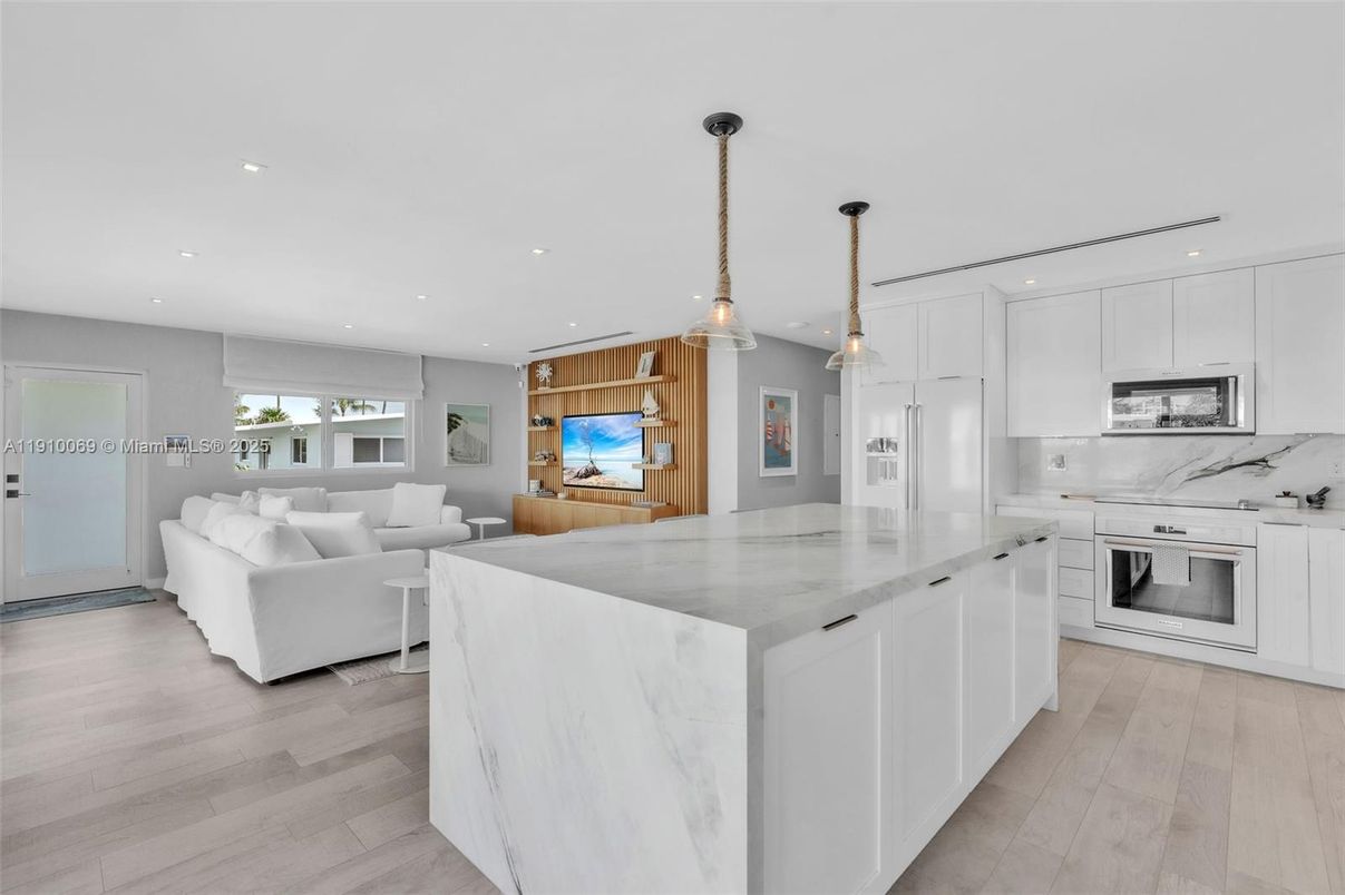 Interior, Kitchen, Living room, Marble Walls, Pendant Lights, Recessed Lighting, Stainless Steel Appliances, Wood Texture Flooring