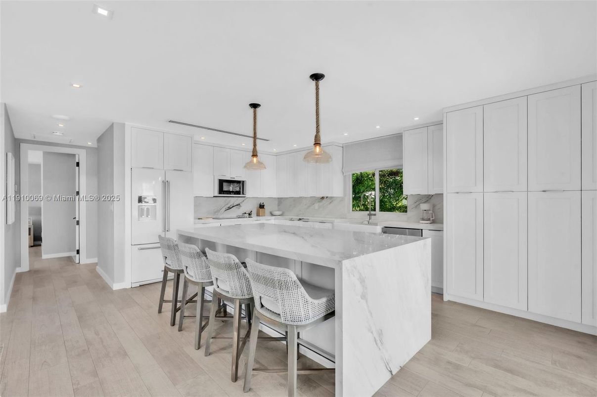 Interior, Kitchen, Marble Walls, Pendant Lights, Recessed Lighting, Stainless Steel Appliances, Wood Texture Flooring