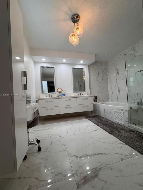Bathroom, Dual Sink Vanities, Glass Shower, Interior, Marble, Marble Walls, Recessed Lighting