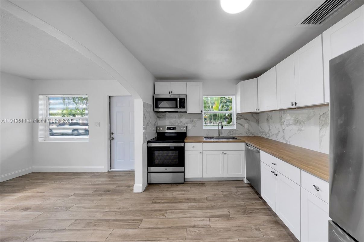 Interior, Kitchen, Marble Walls, Stainless Steel Appliances, Wood Texture Flooring