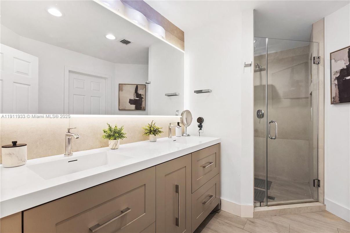 Bathroom, Dual Sink Vanities, Glass Shower, Interior, Recessed Lighting, Wood Texture Flooring