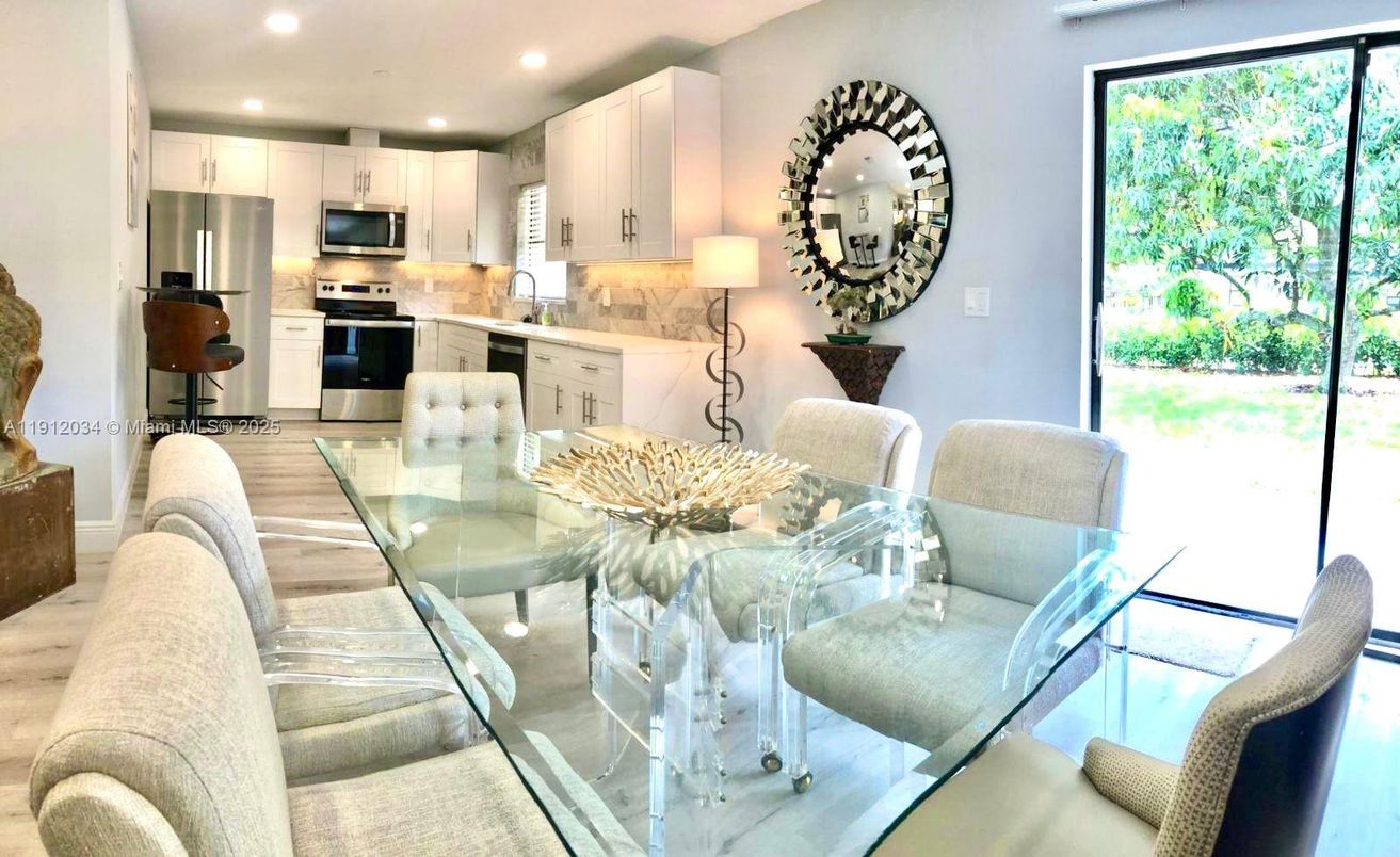 Dining room, Interior, Kitchen, Recessed Lighting, Stainless Steel Appliances, Wood Texture Flooring