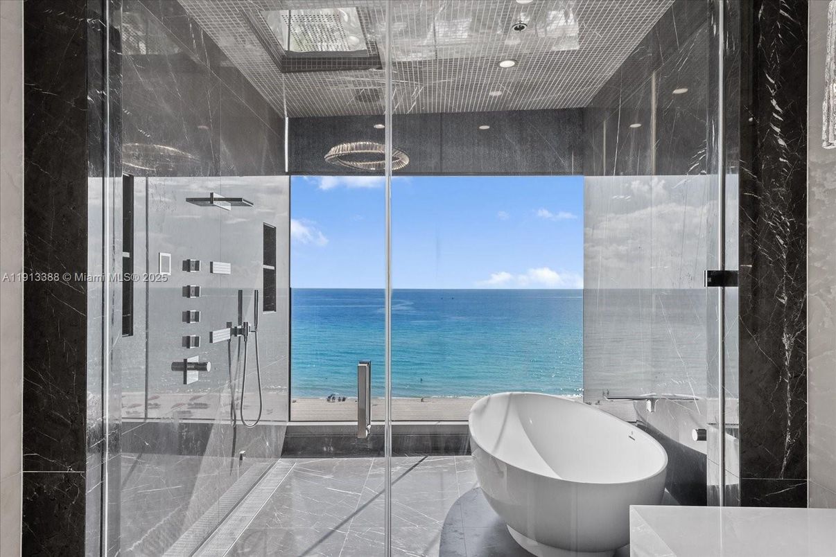 Bathroom, Free Standing Baths, Glass Shower, Interior, Marble Walls, Recessed Lighting, Water