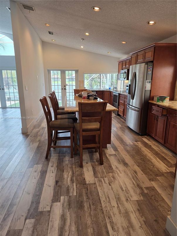 Dining room, Interior, Kitchen, Recessed Lighting, Stainless Steel Appliances, Wood Texture Flooring