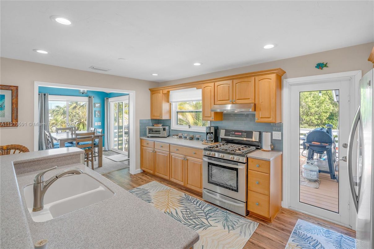 Dining room, Interior, Kitchen, Recessed Lighting, Stainless Steel Appliances, Wood Texture Flooring