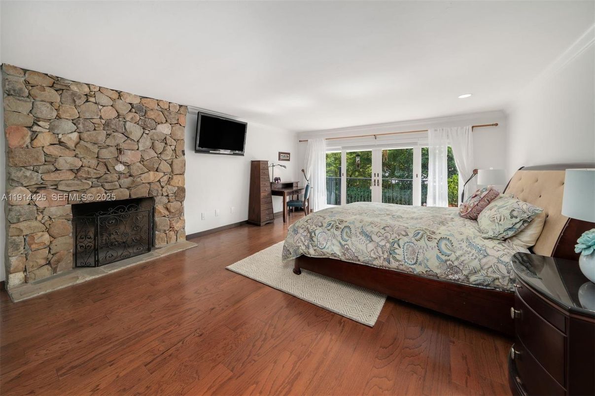 Bedroom, Fireplace, Interior, Recessed Lighting, Stone Walls, Wood Texture Flooring