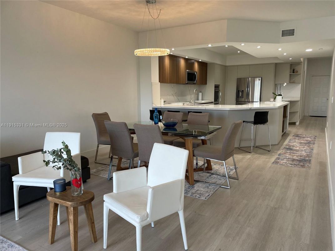 Dining room, Interior, Kitchen, Pendant Lights, Recessed Lighting, Stainless Steel Appliances, Wood Texture Flooring