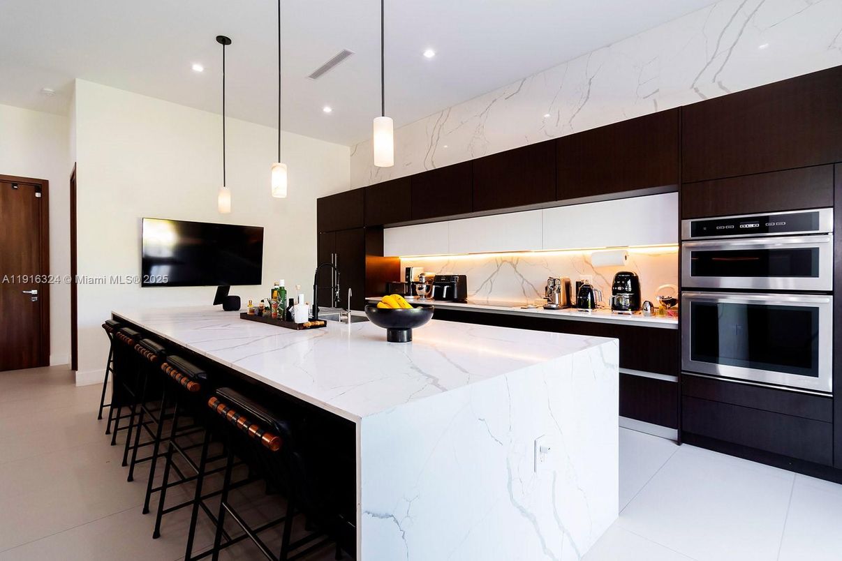 Interior, Kitchen, Marble Walls, Pendant Lights, Recessed Lighting, Stainless Steel Appliances
