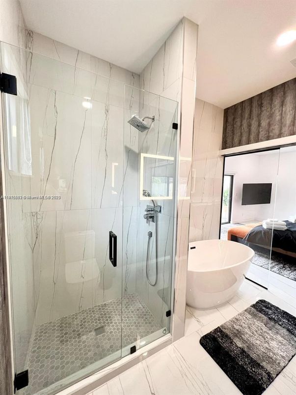 Bathroom, Bedroom, Free Standing Baths, Glass Shower, Interior, Marble, Marble Walls, Recessed Lighting