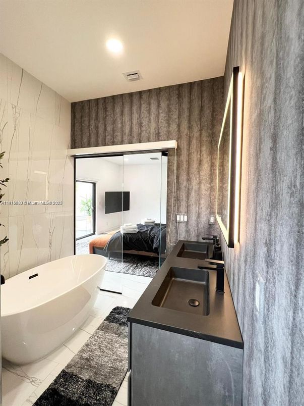 Bathroom, Bedroom, Dual Sink Vanities, Free Standing Baths, Interior, Marble Walls, Recessed Lighting