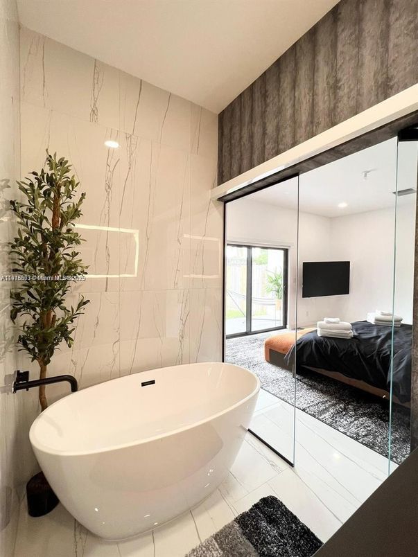 Bathroom, Bedroom, Free Standing Baths, Glass Shower, Interior, Marble Walls, Recessed Lighting