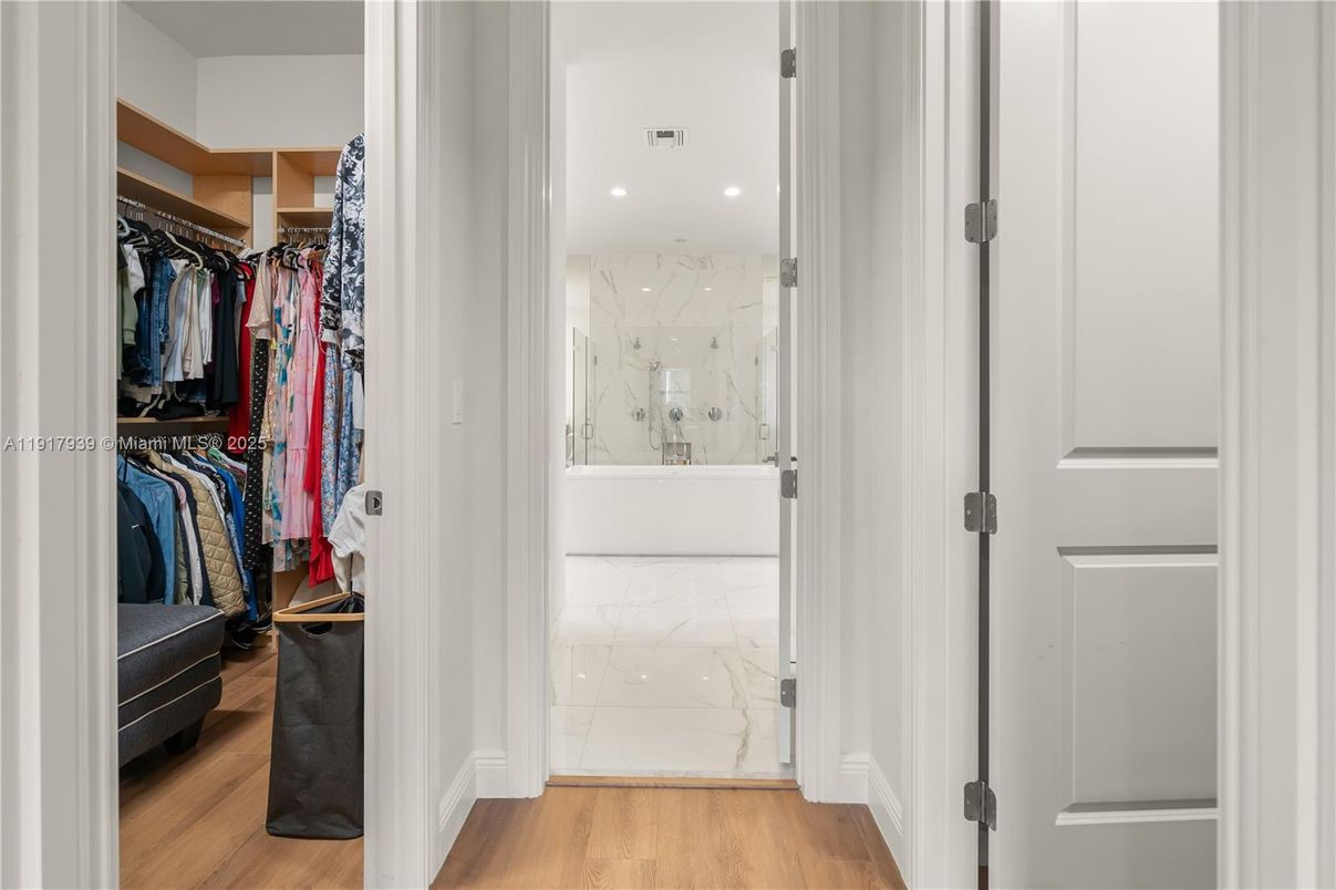 Bathroom, Glass Shower, Interior, Marble, Marble Walls, Recessed Lighting, Walk-in Closets, Wood Texture Flooring