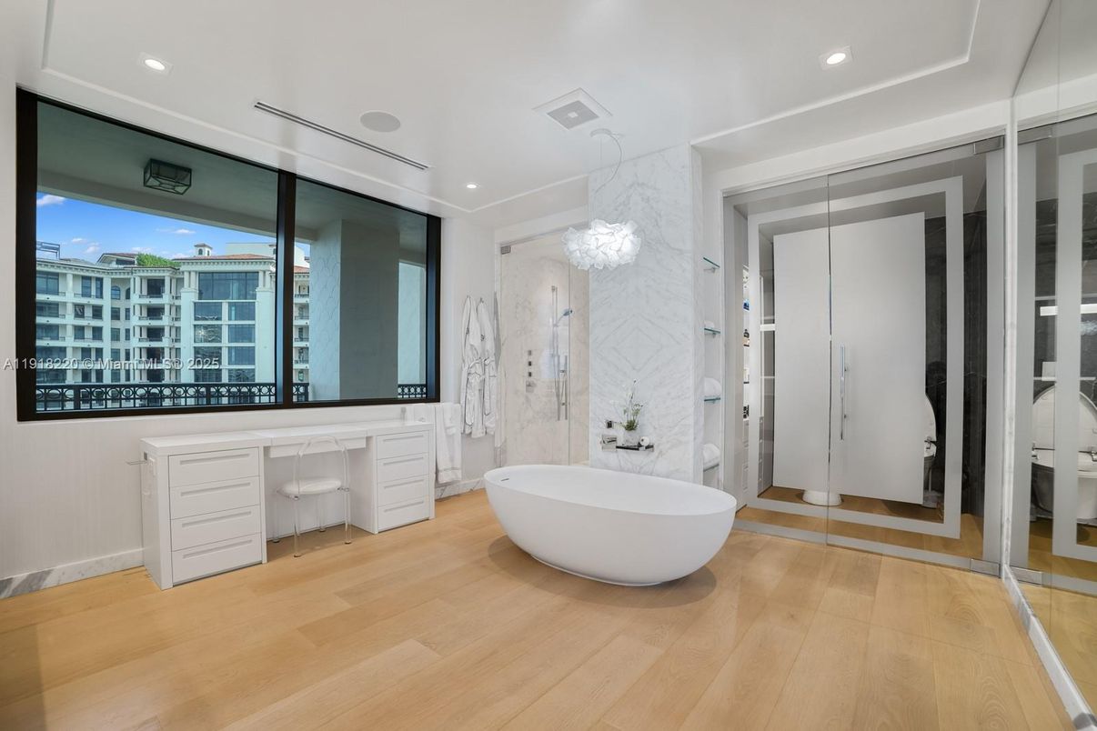 Bathroom, Chandelier, Free Standing Baths, Interior, Marble Walls, Recessed Lighting, Wood Texture Flooring