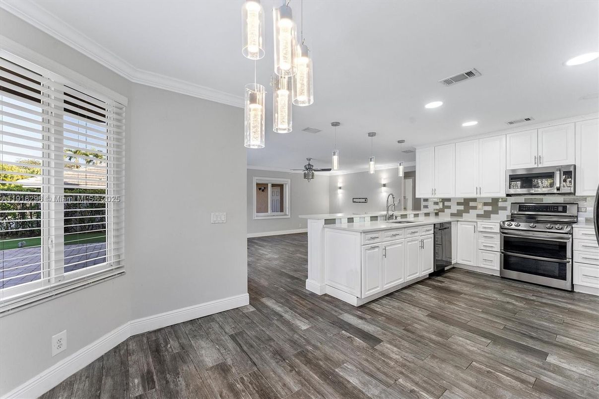 Interior, Kitchen, Pendant Lights, Recessed Lighting, Stainless Steel Appliances, Wood Texture Flooring