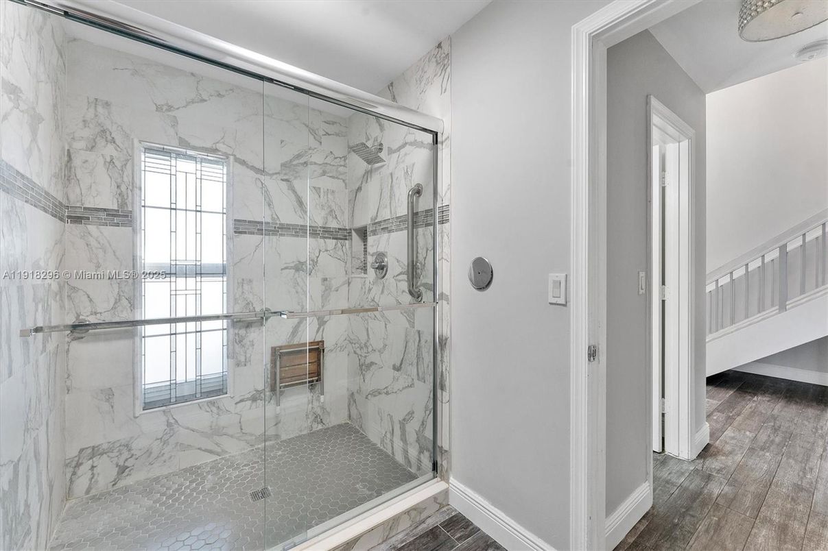 Bathroom, Glass Shower, Interior, Marble Walls, Wood Texture Flooring