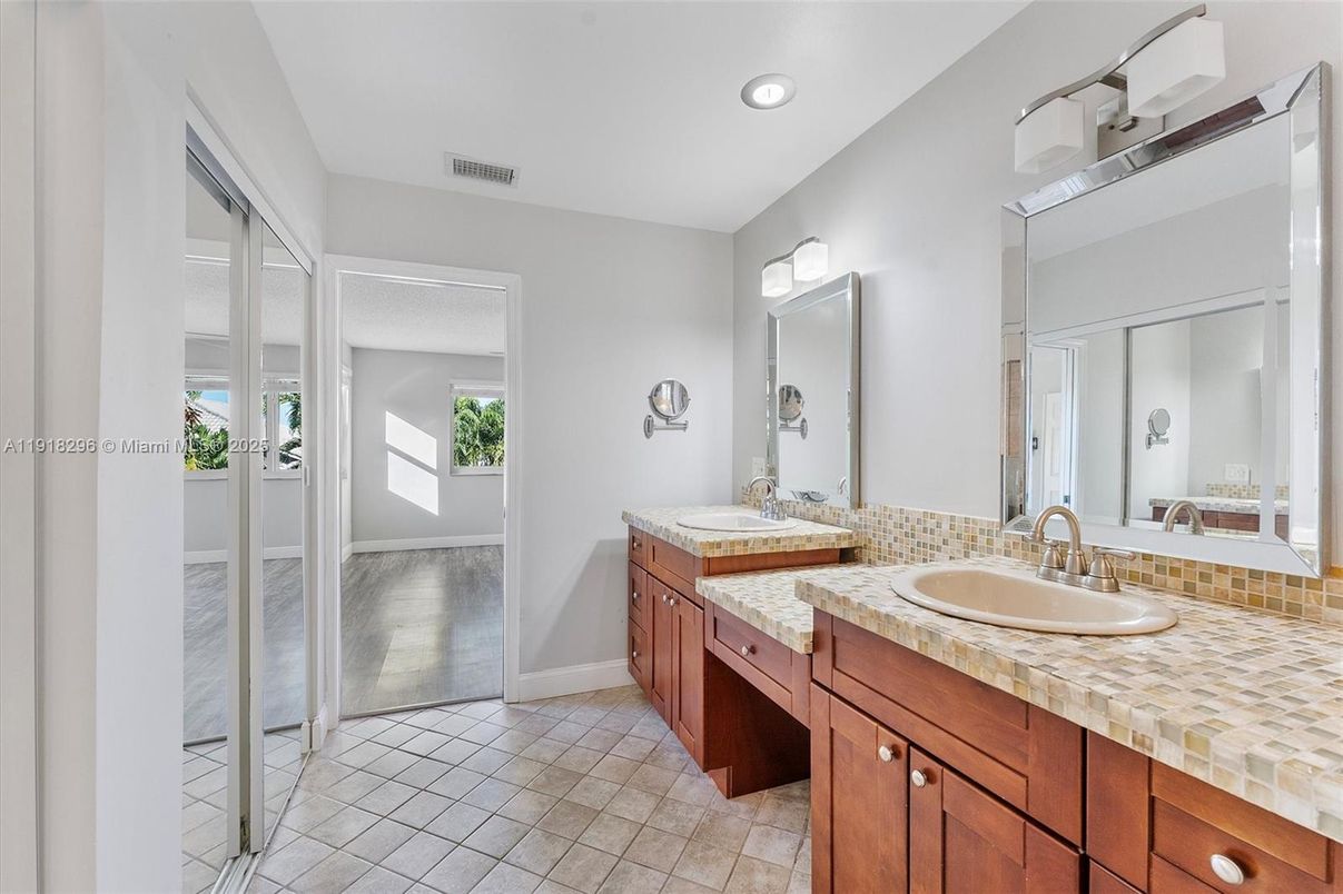 Bathroom, Dual Sink Vanities, Interior, Recessed Lighting, Tile Countertops
