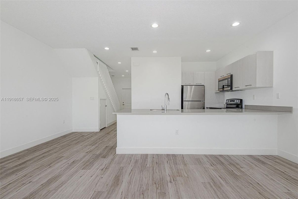 Interior, Kitchen, Recessed Lighting, Stainless Steel Appliances, Wood Texture Flooring
