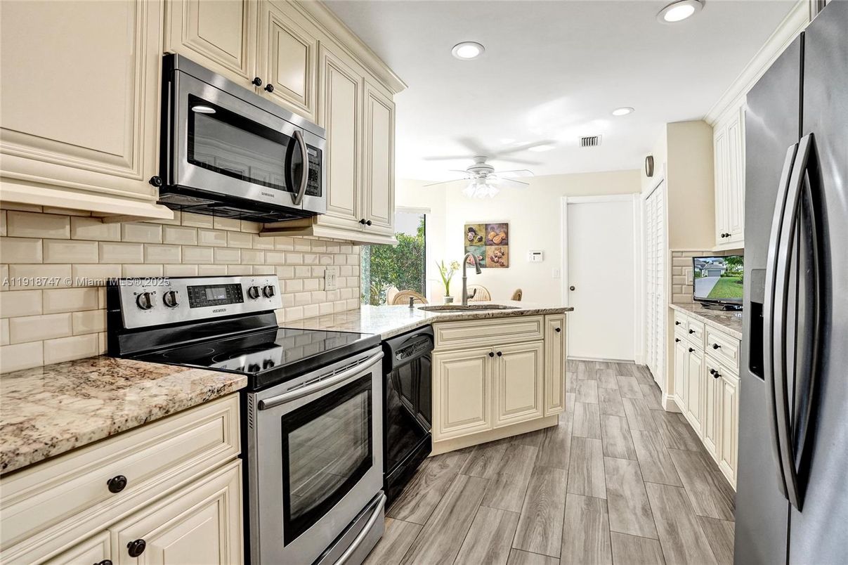 Interior, Kitchen, Recessed Lighting, Stainless Steel Appliances, Wood Texture Flooring