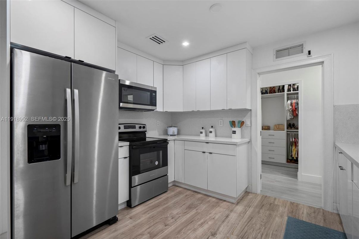 Interior, Kitchen, Recessed Lighting, Stainless Steel Appliances, Wood Texture Flooring