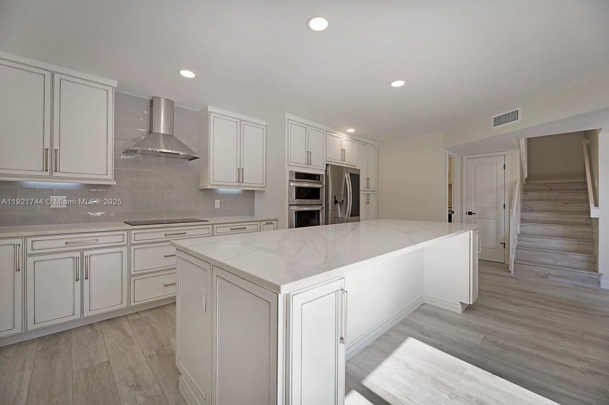 Interior, Kitchen, Recessed Lighting, Stainless Steel Appliances, Wood Texture Flooring