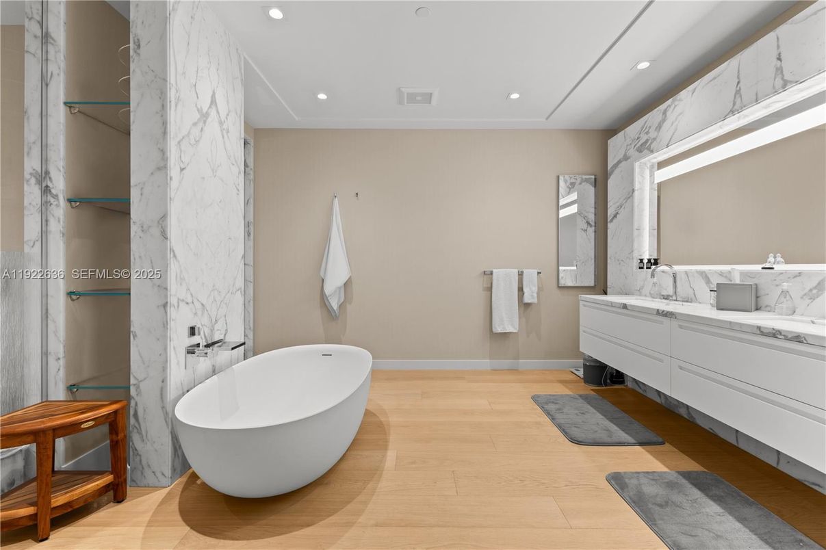Bathroom, Free Standing Baths, Interior, Marble Walls, Recessed Lighting, Wood Texture Flooring