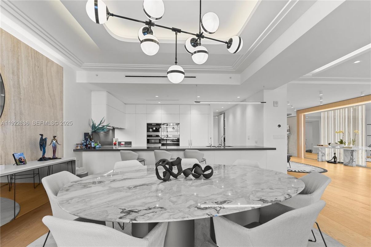 Dining room, Interior, Kitchen, Pendant Lights, Recessed Lighting, Stainless Steel Appliances, Wood Texture Flooring