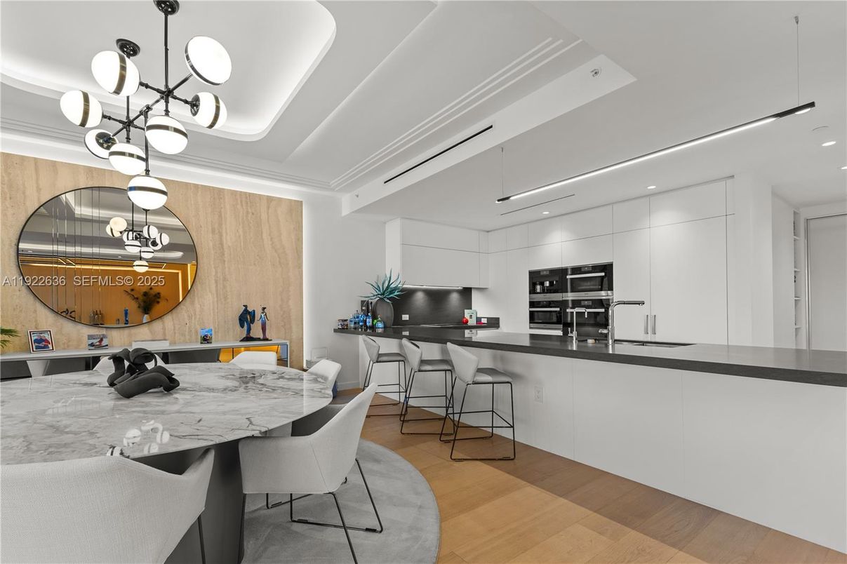 Dining room, Interior, Kitchen, Pendant Lights, Recessed Lighting, Stainless Steel Appliances, Wood Texture Flooring