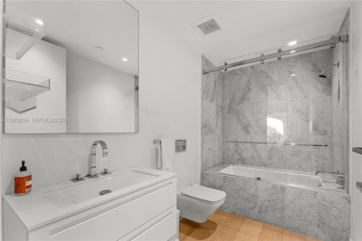 Bathroom, Glass Shower, Interior, Marble Walls, Recessed Lighting, Wood Texture Flooring