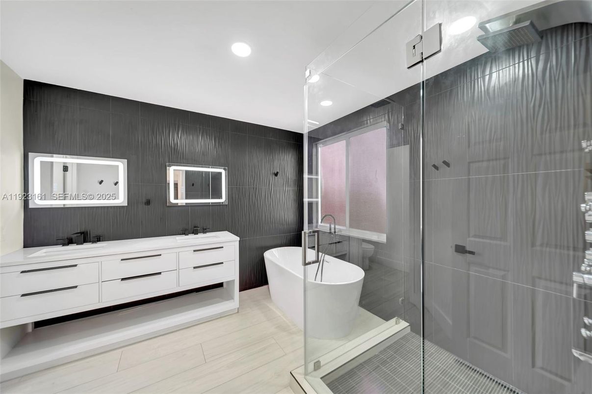 Bathroom, Dual Sink Vanities, Free Standing Baths, Glass Shower, Interior, Recessed Lighting, Wood Texture Flooring