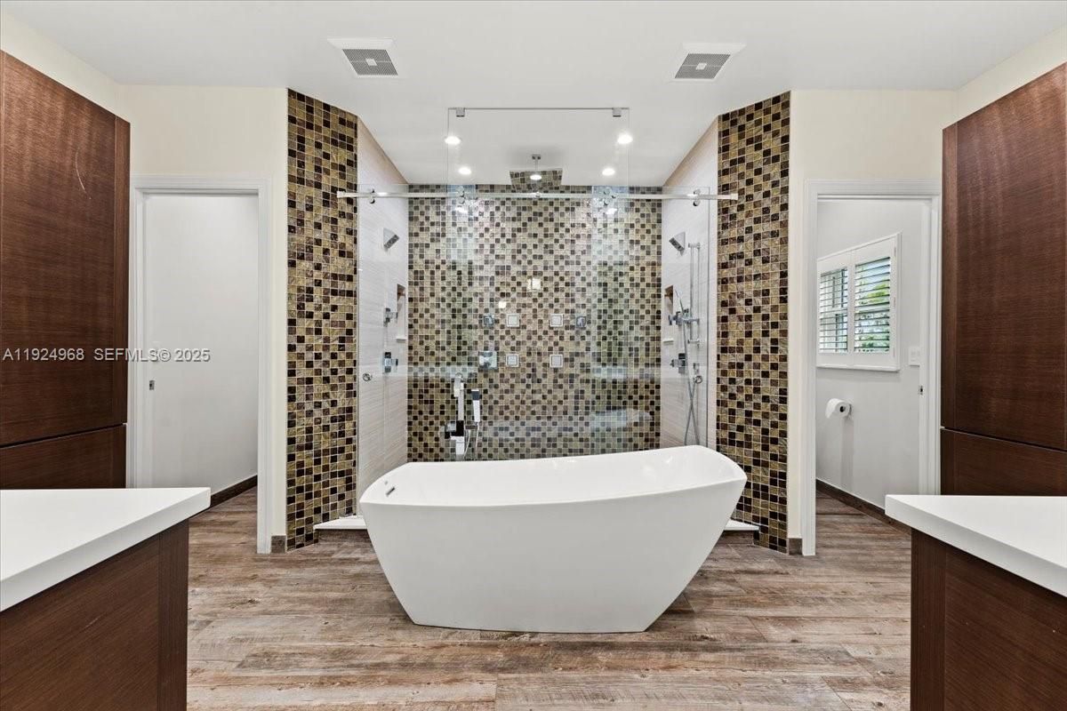 Bathroom, Free Standing Baths, Glass Shower, Interior, Recessed Lighting, Wood Texture Flooring