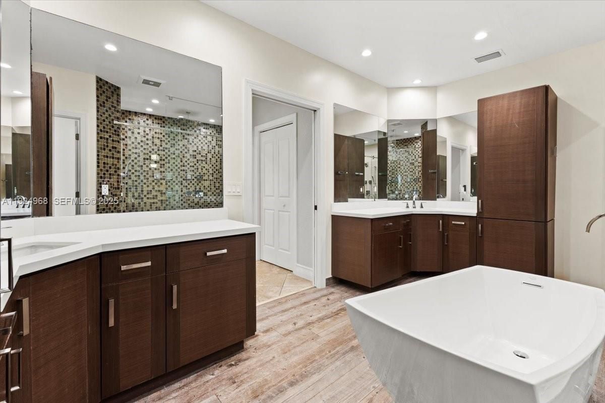 Bathroom, Dual Sink Vanities, Free Standing Baths, Glass Shower, Interior, Recessed Lighting, Wood Texture Flooring